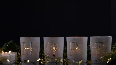 Candles that spell Hope Nested in Gold star Decoration. Christmas Stock-Footage 128747687