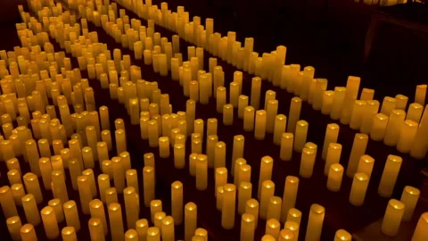Candles on a stage panning right Stock Footage 243370961