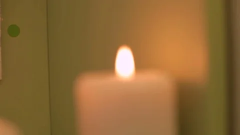 Candles stand on the shelf Vídeo Stock 83410877
