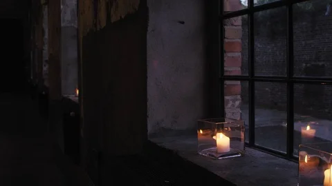Candles on stonework window sill Stock Footage 101872631