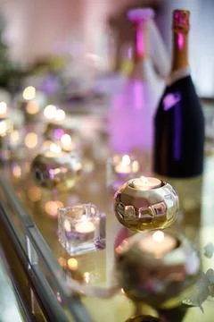 Candles on the table at the wedding party Stock Photos