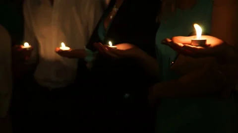 Candles in their hands 動画素材 55250332