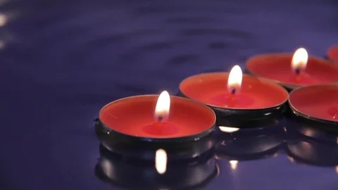 Candles on the water Stock Footage 76397982