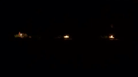 Candles waving with nice reflection on water surface in the night Stock Footage 133939258