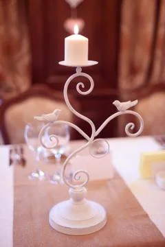 Candles on white metal Stock Photos