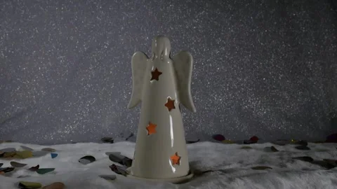 Candlestick angel with star-shaped hole. Stock Footage 98546853
