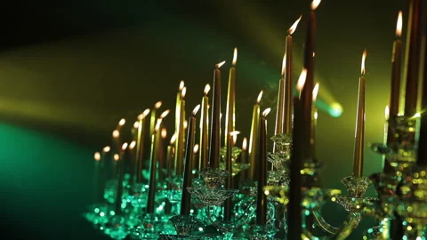 Candlestick with burning candles on the festive table, low light background Stock Footage 141750891