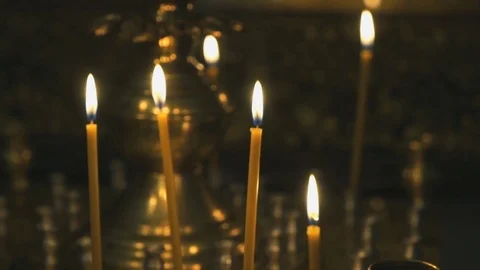 Candlestick with burning candles in the temple Stock Footage 80369355