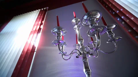 Candlestick with candles in a restaurant with sun Video stock 39573264
