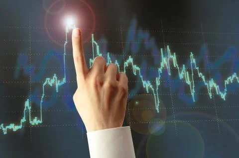 Candlestick chart and hand Foto stock