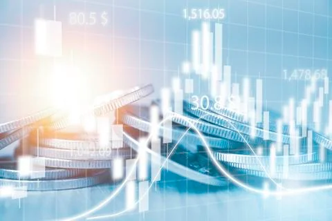 Candlestick chart and trend graph with coins stacking for financial stock Stock Photos