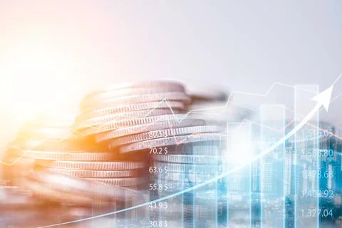 Candlestick chart and trend graph with coins stacking for financial stock Stock Photos