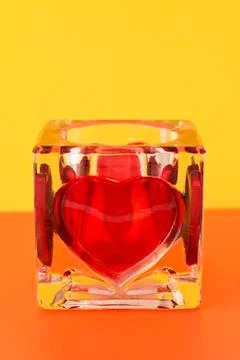 Candlestick with red heart shape Stock Photos