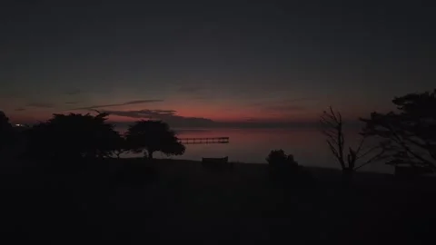 Candlestick sunrise with pier Stock Footage 327169322