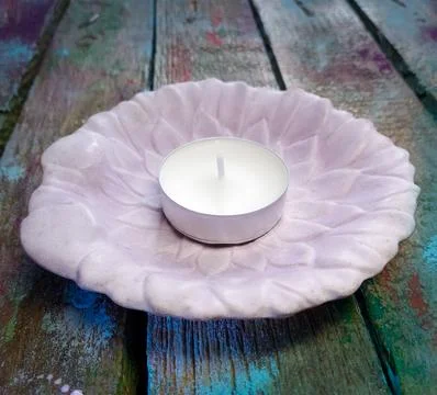 Candlestick with tea candle Stock Photos