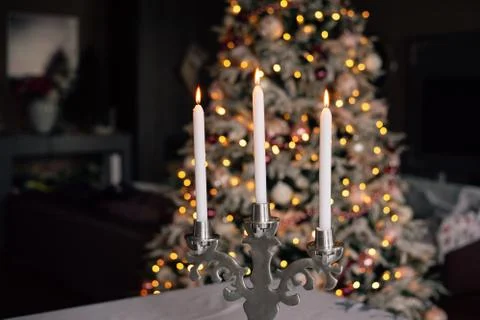 Candlestick with three candles Stock Photos
