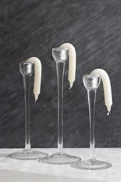 Candlesticks in candlesticks melted from the sun or heat and went down Stock Photos