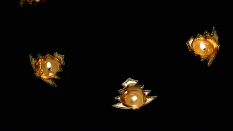 Candlesticks in the shape of a Christmas tree rotate in a circle. The view from Stock Footage 125810734