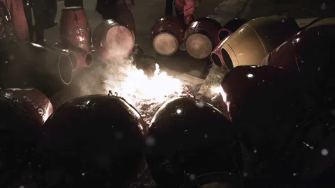 Candombe Drummers Heating and Tuning Drums Over Fire Before Llamadas Parade - 4K Stock Footage 323294145