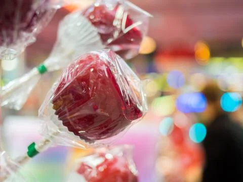 Candy apples at a funfair stand with blurred background Stock Photos