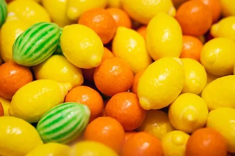 Candy background with fruit-shaped chewy sweets, close-up. Stock Photos