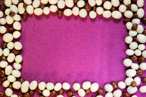 Candy background, white pebbles stone sweet raisins glazein the form of a fra Stock-Fotos