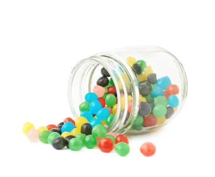 Candy ball sweets falling out of a jar Stock Photos