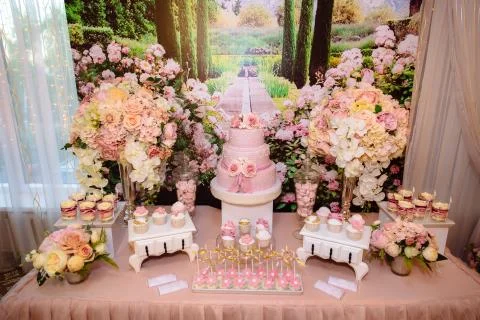 Candy bar and wedding cake. Table with sweets, buffet with cupcakes, candies Stock Photos
