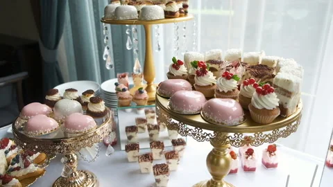 Candy bar. Buffet with delicacies at the wedding. Confectionery. Macaroons Stock Footage 142522938