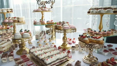 Candy bar. Buffet with delicacies at the wedding. Confectionery. Macaroons Stock Footage 142522980