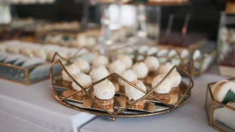 Candy bar. Buffet with delicacies at the wedding. Confectionery. Macaroons Stock Footage 196084832