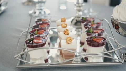 Candy bar. Buffet with delicacies at the wedding. Confectionery. Macaroons Stock Footage 196876797