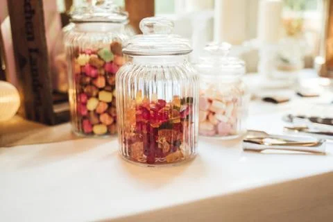 Candy bar. Close up of glassware with different chewy candies and marshmallows Stock Photos
