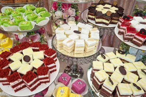 Candy bar with different assortments of cakes at a wedding Фото