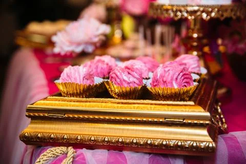 Candy bar marshmallow on the table in a vase, a plate in pink, macaroon, cake Stock Photos