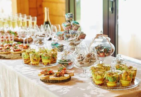 Candy bar, sweet buffet table, champagne snacks Stock Photos