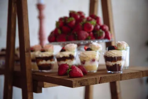 Candy bar. Table with sweets, buffet with cupcakes, candies, dessert. Stock Photos