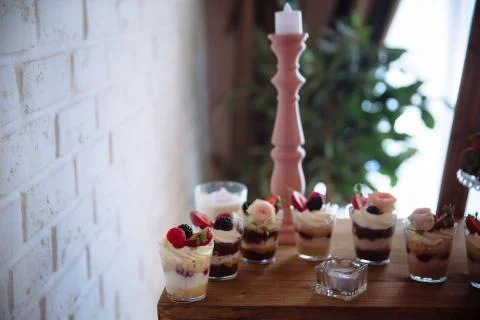 Candy bar. Table with sweets, buffet with cupcakes, candies, dessert. Stock Photos