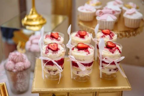 Candy bar. Table with sweets, buffet with cupcakes, candies, dessert. Stock Photos