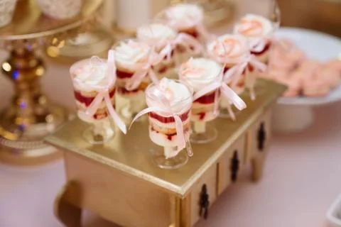 Candy bar. Table with sweets, buffet with cupcakes, candies, dessert Stock Photos