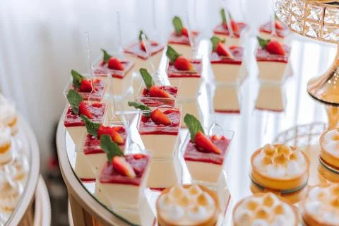Candy bar. Table with sweets, candies, dessert. cakes and berries in the ca.. Stock Photos