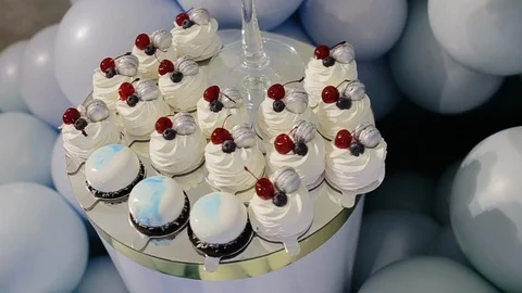 Candy bar, table with sweets, delicious sweet cupcakes lie on a table. The Stock Footage 129457100