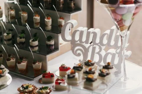Candy bar text  at wedding reception. White and chocolate desserts with fruit Stock Photos