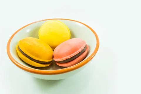 Candy came to be placed in a cup on a white background. Stock Photos