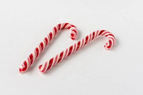 Candy candy cane on a white background. Symbol of the new year. Children's sw Stock Photos