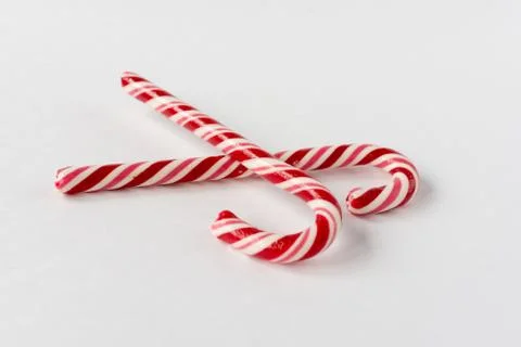 Candy candy cane on a white background. Symbol of the new year. Children's sw Foto stock