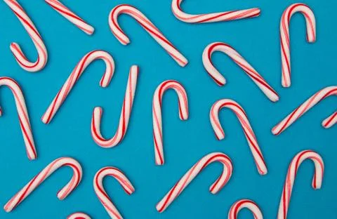 A Candy Cane Background on a Blue Background Stock Photos