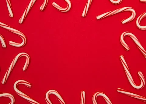 A Candy Cane Background on a Red Background Stock Photos