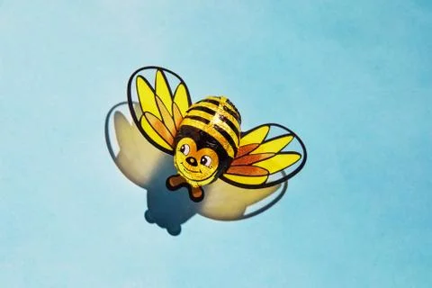 Candy cane bee with shadow. The concept of the Rosh Hashanah holiday - the Je Stock Photos