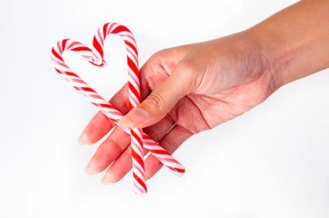 Candy cane heart in hand Stock-Fotos